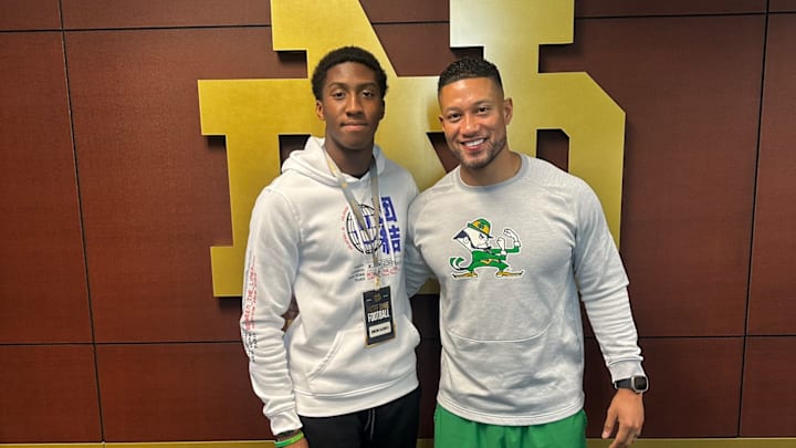 2026 defender Simeon Caldwell poses with Notre Dame head coach Marcus Freeman