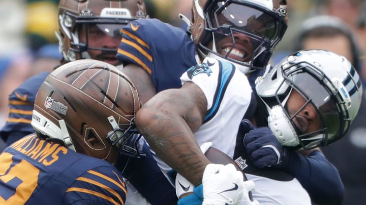 Green Bay Packers safety Evan Williams (33) and linebacker Edgerrin Cooper tackle Carolina Panthers running back Rico Dowdle. Green Bay Packers safety Evan Williams (33) and linebacker Edgerrin Cooper tackle Carolina Panthers running back Rico Dowdle.