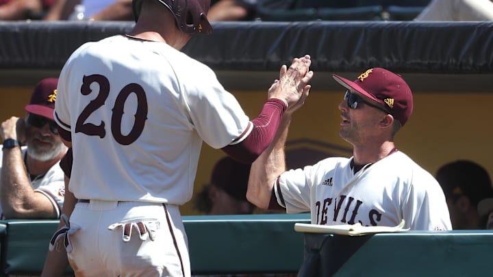 ASU's Spencer Torkelson (20) high-fives hitting coach Michael Earley after Torkelson scored against Arizona during a game at Phoenix Municipal Stadium in Phoenix, Ariz. on March 30, 2019.
Z6i9069 ASU's Spencer Torkelson (20) high-fives hitting coach Michael Earley after Torkelson scored against Arizona during a game at Phoenix Municipal Stadium in Phoenix, Ariz. on March 30, 2019.
Z6i9069