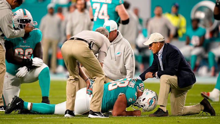Miami Dolphins guard Connor Williams (58) is check out by staff during the first quarter against the