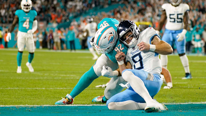 Miami Dolphins defensive tackle Zach Sieler (92) scores a touchdown off of an interception past Tennessee Titans quarterback Will Levis (8) during the first quarter at Hard Rock Stadium in Miami, Fla., Monday, Dec. 11, 2023.