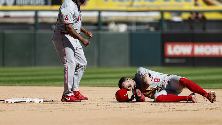 Sep 26, 2024; Chicago, Illinois, USA; Los Angeles Angels shortstop Zach Neto (9) reacts after injuring himself during the fourth inning of a baseball game against the Chicago White Sox at Guaranteed Rate Field.