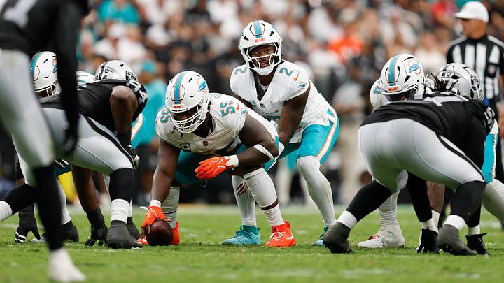 Miami Dolphins center Aaron Brewer (55) prepares to snap the ball to quarterback Malik Willis (2) against the Las Vegas Raiders at Allegiant Stadium. Miami Dolphins center Aaron Brewer (55) prepares to snap the ball to quarterback Malik Willis (2) against the Las Vegas Raiders at Allegiant Stadium.