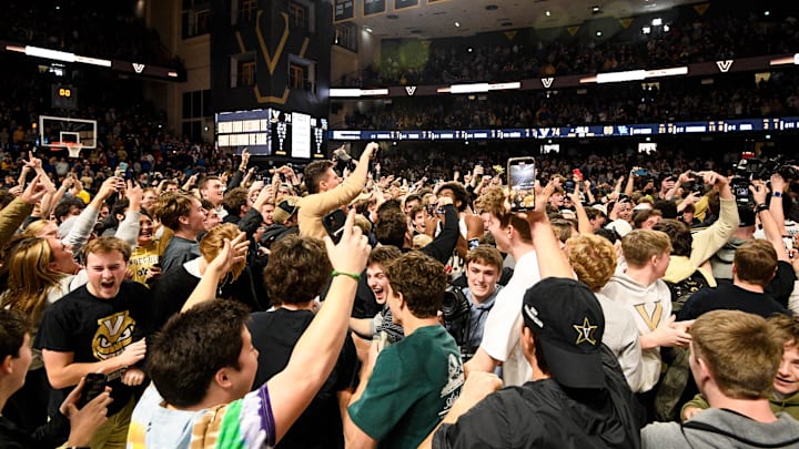 Jan 25, 2025; Nashville, Tennessee, USA;  Vanderbilt Commodores students rush the court after the upset of Kentucky Wildcats during the second half at Memorial Gymnasium. Mandatory Credit: Steve Roberts-Imagn Images