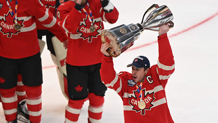 Feb 20, 2025; Boston, MA, USA; [Imagn Images direct customers only]  Team Canada forward Sidney Crosby (87) lifts the 4 Nations Face-Off trophy after winning against Team USA in overtime  during the 4 Nations Face-Off ice hockey championship game at TD Garden. Mandatory Credit: Brian Fluharty-Imagn Images