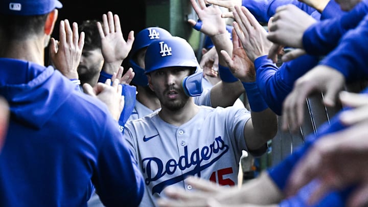 Los Angeles Dodgers catcher Austin Barnes celebrates in the dugout after scoring a run earlier this season.