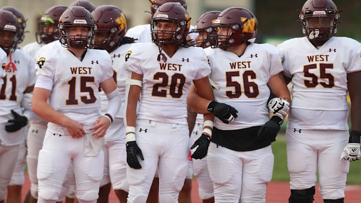 Wichita West players await their introduction to take on Topeka High at Hummer Sports Park on Sept. 4, 2025.
