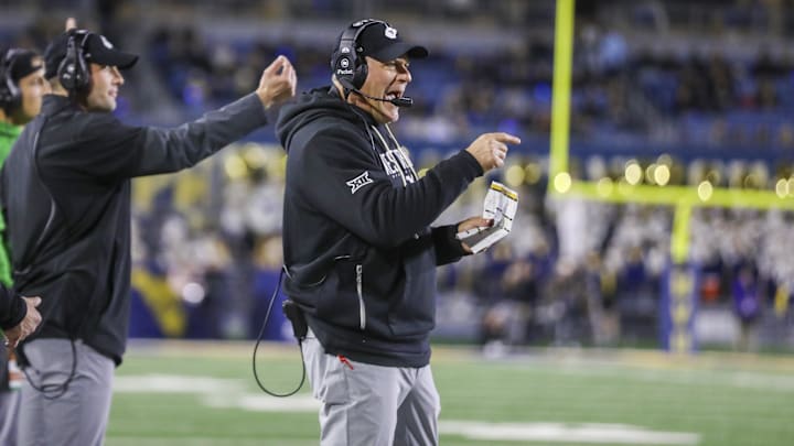 Oct 25, 2025; Morgantown, West Virginia, USA; West Virginia Mountaineers head coach Rich Rodriguez calls out a play during the third quarter against the Texas Christian University Horned Frogs at Milan Puskar Stadium. Mandatory Credit: Ben Queen-Imagn Images Oct 25, 2025; Morgantown, West Virginia, USA; West Virginia Mountaineers head coach Rich Rodriguez calls out a play during the third quarter against the Texas Christian University Horned Frogs at Milan Puskar Stadium. Mandatory Credit: Ben Queen-Imagn Images