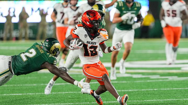 Oregon State Beavers wide receiver Jesse Legree (12) avoids a tackle by Colorado State Rams linebacker Oumar Diomande (2) in the second half at Sonny Lubick Field at Canvas Stadium. Oregon State Beavers wide receiver Jesse Legree (12) avoids a tackle by Colorado State Rams linebacker Oumar Diomande (2) in the second half at Sonny Lubick Field at Canvas Stadium.