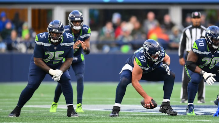 Nov 3, 2024; Seattle, Washington, USA; Seattle Seahawks center Connor Williams (57) snaps the ball to quarterback Geno Smith (7) during the second half against the Los Angeles Rams at Lumen Field. Mandatory Credit: Steven Bisig-Imagn Images Nov 3, 2024; Seattle, Washington, USA; Seattle Seahawks center Connor Williams (57) snaps the ball to quarterback Geno Smith (7) during the second half against the Los Angeles Rams at Lumen Field. Mandatory Credit: Steven Bisig-Imagn Images
