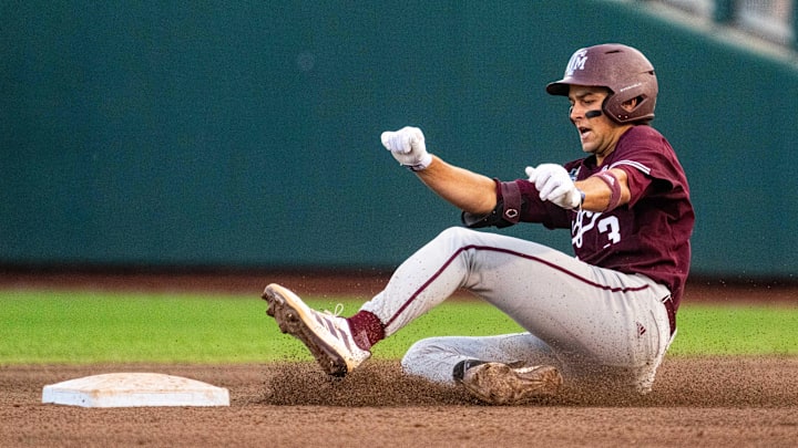 Jun 19, 2024; Omaha, NE, USA; Texas A&M Aggies second baseman Kaeden Kent (3) slides to second after hitting a double against the Florida Gators during the fifth inning at Charles Schwab Field Omaha. Mandatory Credit: Dylan Widger-Imagn Images