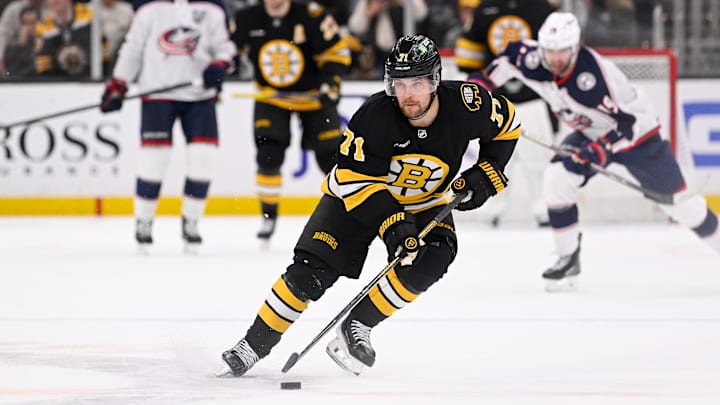 Feb 26, 2026; Boston, Massachusetts, USA; Boston Bruins left wing Viktor Arvidsson (71) skates with the puck towards an empty Columbus Blue Jackets net during the third period at TD Garden. Mandatory Credit: Eric Canha-Imagn Images
