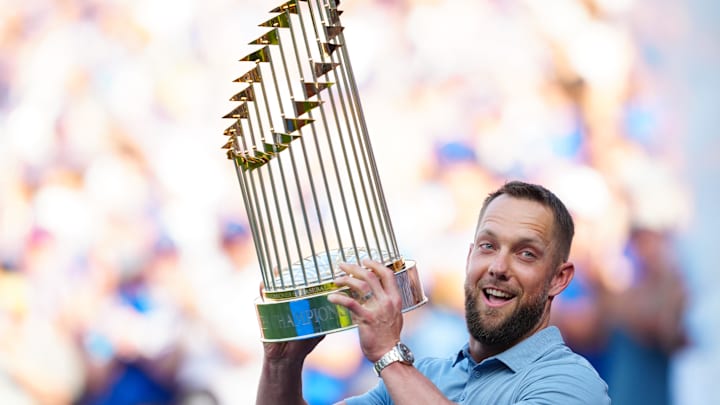 May 6, 2023; Kansas City, Missouri, USA; Former Kansas City Royals outfielder Alex Gordon holds up the 2015 World Series trophy during the retirement ceremony for Lorenzo Cain prior to a game against the Oakland Athletics at Kauffman Stadium. Mandatory Credit: Jay Biggerstaff-Imagn Images May 6, 2023; Kansas City, Missouri, USA; Former Kansas City Royals outfielder Alex Gordon holds up the 2015 World Series trophy during the retirement ceremony for Lorenzo Cain prior to a game against the Oakland Athletics at Kauffman Stadium. Mandatory Credit: Jay Biggerstaff-Imagn Images