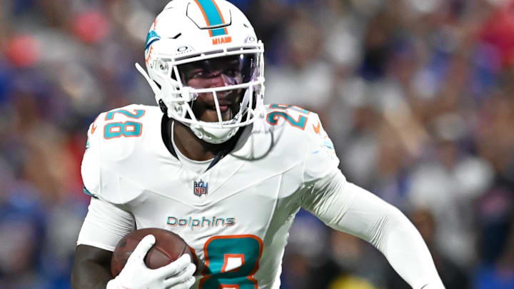 Sep 18, 2025; Orchard Park, New York, USA; Miami Dolphins running back De'von Achane (28) carries the ball against the Buffalo Bills in the first quarter at Highmark Stadium. 