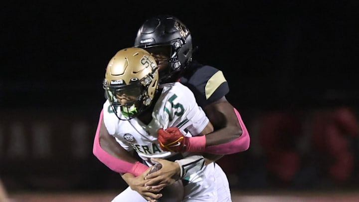 Oaks Christian's Hayden Lowe brings down St. Bonaventure's quarterback Jaxson Carper during the second quarter of Oaks Christian's 35-0 Marmonte League win over visiting St. Bonaventure Friday at Redell Field.