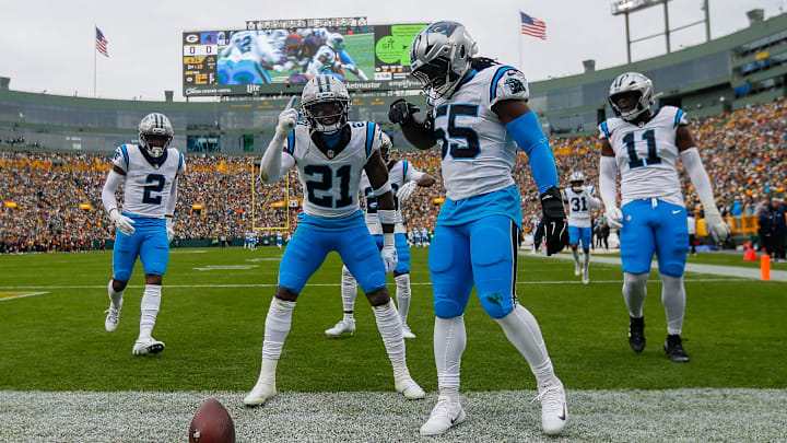 Carolina Panthers safety Nick Scott (21) and linebacker Maema Njongmeta (55) celebrate after Scott recovers a fumble against the Green Bay Packers on Sunday, November 2, 2025, at Lambeau Field in Green Bay, Wis. The Panthers won the game, 16-13, on a 49-yard field goal as time expired.
Tork Mason/USA TODAY NETWORK-Wisconsin