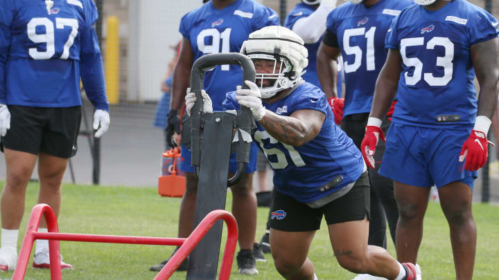 Bills defensive tackle Gable Steveson hits a sled during drills. Bills defensive tackle Gable Steveson hits a sled during drills.
