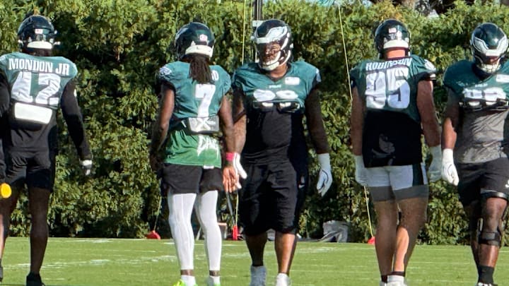 Jalen Carter, between Kelee Ringo (7) and Ty Robinson (95), was at practice during Week 7.