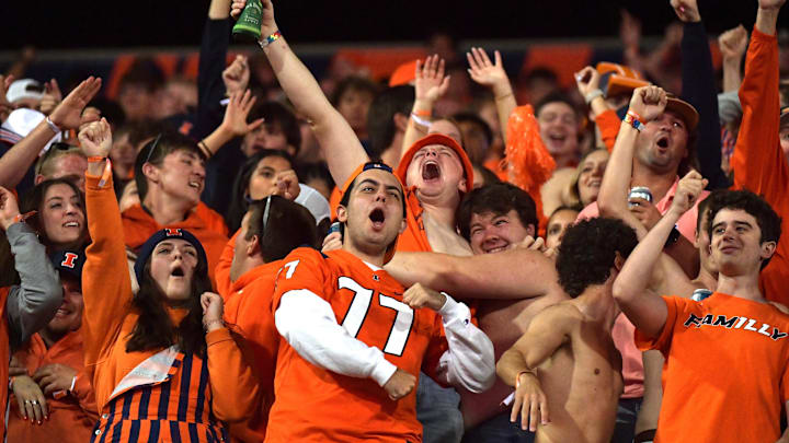 Sep 7, 2024; Champaign, Illinois, USA; Fighting Illini fans cheer during the second half against the Kansas Jayhawks at Memorial Stadium. Mandatory Credit: Ron Johnson-Imagn Images Sep 7, 2024; Champaign, Illinois, USA; Fighting Illini fans cheer during the second half against the Kansas Jayhawks at Memorial Stadium. Mandatory Credit: Ron Johnson-Imagn Images
