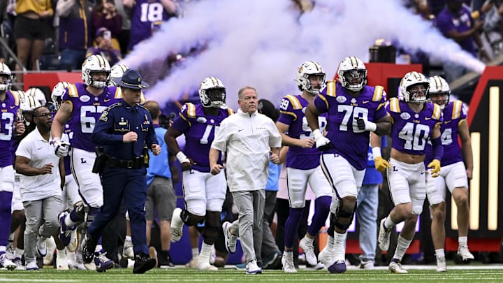 Dec 31, 2024; Houston, TX, USA; LSU Tigers head coach Brian Kelly enters the field with the team prior to the game against the Baylor Bears at NRG Stadium. Mandatory Credit: Maria Lysaker-Imagn Images 