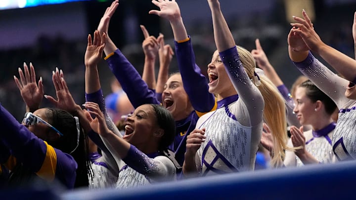 LSU gymnast Livvy Dunne celebrates with teammates during Session 2 of the SEC Gymnastics Championship at Legacy Arena in Birmingham, Alabama. LSU won the event to claim the SEC crown.