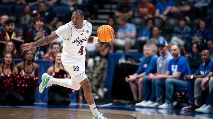 Texas A&M Aggies guard Wade Taylor IV (4) brings the ball up court against Texas during their second round game of the SEC Men's Basketball Tournament at Bridgestone Arena in Nashville, Tenn., Thursday, March 13, 2025. Texas A&M Aggies guard Wade Taylor IV (4) brings the ball up court against Texas during their second round game of the SEC Men's Basketball Tournament at Bridgestone Arena in Nashville, Tenn., Thursday, March 13, 2025.