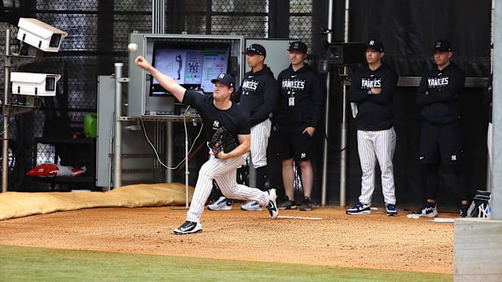 Feb 19, 2023; Tampa, FL, USA;  New York Yankees starting pitcher Gerrit Cole (45)  throws a bullpen session as he works out during spring training practice at George M. Steinbrenner Field. Mandatory Credit: Kim Klement-Imagn Images