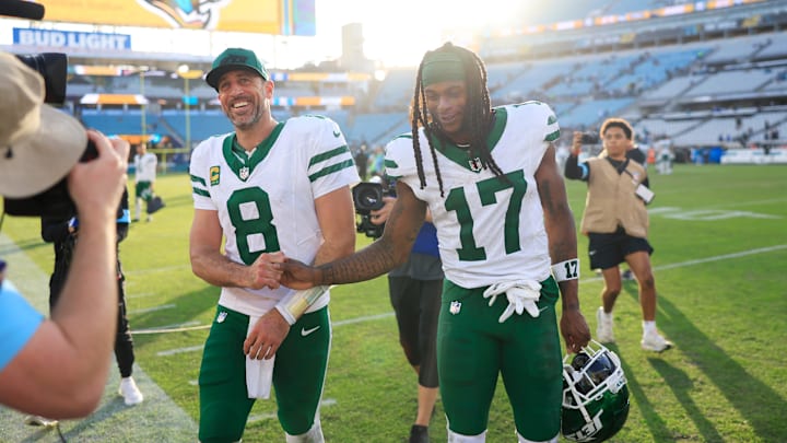 New York Jets quarterback Aaron Rodgers (8) and wide receiver Davante Adams (17) high-five each other as they walks off the field after the game Sunday, Dec. 15, 2024 at EverBank Stadium in Jacksonville, Fla. The Jets held off the Jaguars 32-25. [Corey Perrine/Florida Times-Union]