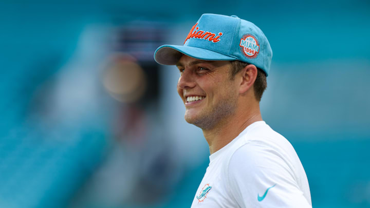 Miami Dolphins quarterback Zach Wilson (0) looks on before a game against the New England Patriots at Hard Rock Stadium. Miami Dolphins quarterback Zach Wilson (0) looks on before a game against the New England Patriots at Hard Rock Stadium.