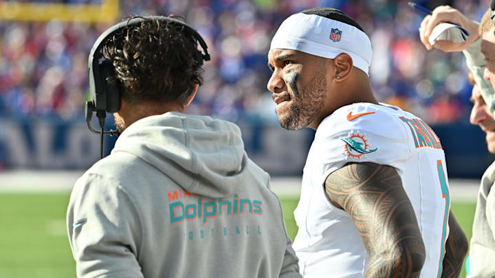 Miami Dolphins quarterback Tua Tagovailoa (1) on the sidelines with head coach Mike McDaniel in the second quarter game against the Buffalo Bills at Highmark Stadium.