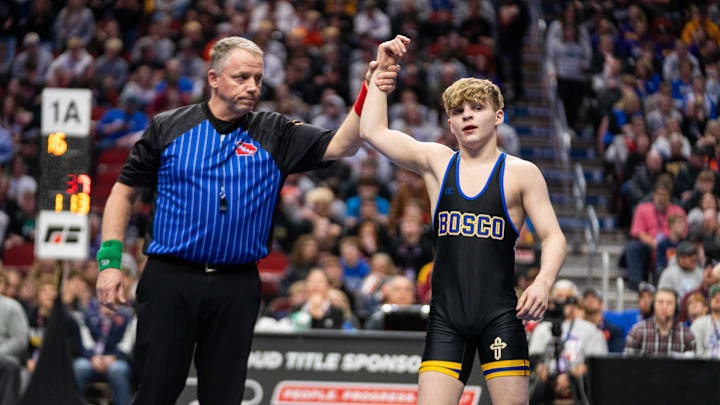 Don Bosco's Hendrix Schwab wins over Wilton's Austin Etzel at 113 lbs during the Class 1A state wresting final on Saturday, Feb. 22, 2025, at Wells Fargo Arena in Des Moines. Don Bosco's Hendrix Schwab wins over Wilton's Austin Etzel at 113 lbs during the Class 1A state wresting final on Saturday, Feb. 22, 2025, at Wells Fargo Arena in Des Moines.