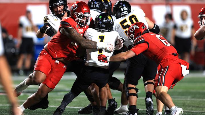 Sep 3, 2026; Salt Lake City, Utah, USA; Idaho Vandals quarterback Israel Carter (1) is tackled by Utah Utes defensive tackle Karson Kaufusi (51) and safety Nate Ritchie (6) during the third quarter at Rice-Eccles Stadium. Mandatory Credit: Rob Gray-Imagn Images Sep 3, 2026; Salt Lake City, Utah, USA; Idaho Vandals quarterback Israel Carter (1) is tackled by Utah Utes defensive tackle Karson Kaufusi (51) and safety Nate Ritchie (6) during the third quarter at Rice-Eccles Stadium. Mandatory Credit: Rob Gray-Imagn Images