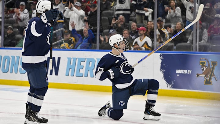 Penn State men's hockey forward Nicholas DeGraves celebrating a goal in the Frozen Four