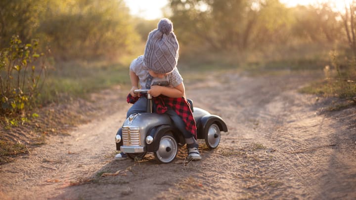Little Everbern loves his toy car.