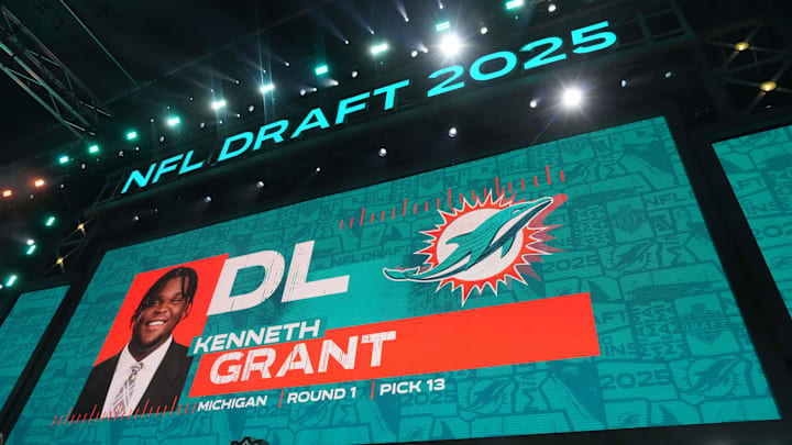 Michigan Wolverines defensive lineman Kenneth Grant is selected as the No. 13 pick by the Miami Dolphins during the NFL Draft at Lambeau Field.