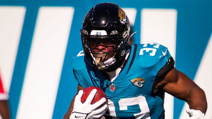 Jacksonville Jaguars running back Bhayshul Tuten (33) returns a kick off in the first quarter during an NFL football game at EverBank Stadium, Sunday, Dec. 14, 2025, in Jacksonville, Fla.