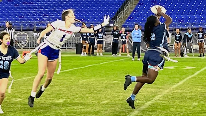 Clarksburg's Aysia Johnson leaps to intercept a pass on the turf at M&T Bank Stadium. Clarksburg's Aysia Johnson leaps to intercept a pass on the turf at M&T Bank Stadium.