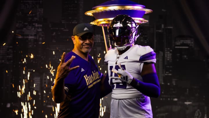 UW defensive-line coach Jason Kaufusi and Alabama edge rusher Caleb Smith pose on the player's visit. UW defensive-line coach Jason Kaufusi and Alabama edge rusher Caleb Smith pose on the player's visit.