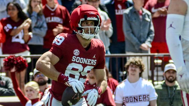 Oklahoma tight end Hayden Hansen stands up after catching a pass in the spring game.