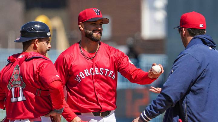 Patrick Sandoval hands the ball to manager Chad Tracy in the fourth inning of his rehab start in Worcester April 8.
