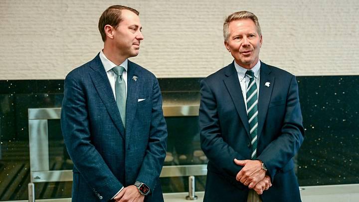 Michigan State University President Kevin Guskiewicz, right, as MSU Athletic Director J Batt looks on before the two’s panel discussion hosted by the Lansing Economic Club on Thursday, Sept. 11, 2025, at the Kellogg Center in East Lansing. Michigan State University President Kevin Guskiewicz, right, as MSU Athletic Director J Batt looks on before the two’s panel discussion hosted by the Lansing Economic Club on Thursday, Sept. 11, 2025, at the Kellogg Center in East Lansing.