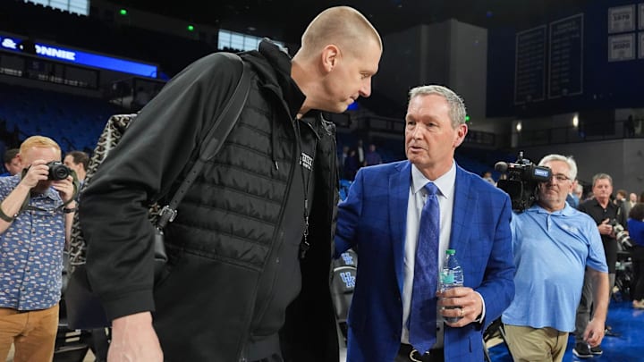 Outgoing Kentucky Athletic Director Mitch Barnhart gets congratulated by UK men's basketball coach Mark Pope at the Historic Memorial Coliseum in Lexington, Kentucky. Barnhart became UK's AD in 2002, he spent 24 years leading the Kentucky's athletic department. March 6, 2026. Outgoing Kentucky Athletic Director Mitch Barnhart gets congratulated by UK men's basketball coach Mark Pope at the Historic Memorial Coliseum in Lexington, Kentucky. Barnhart became UK's AD in 2002, he spent 24 years leading the Kentucky's athletic department. March 6, 2026.