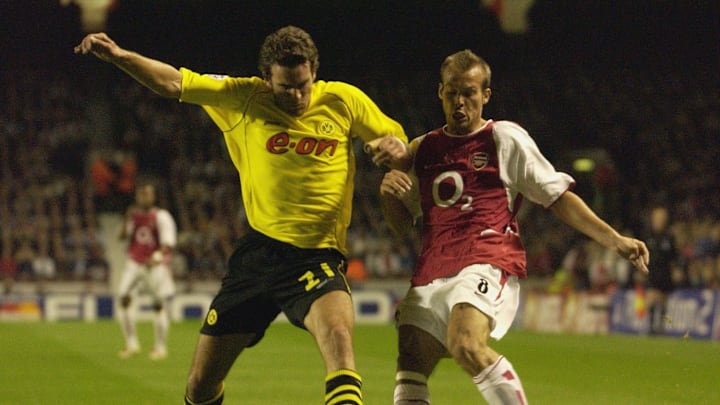 Ljungberg of Arsenal tackles Metzelder of D'mund