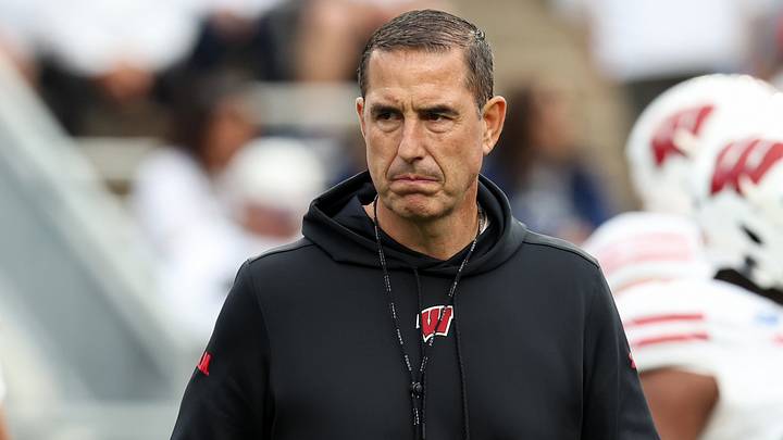 Sep 26, 2026; University Park, Pennsylvania, USA;  Wisconsin Badgers head coach Luke Fickell walks on the field during a warmup prior to the game against the Penn State Nittany Lions at West Shore Home Field at Beaver Stadium.  Mandatory Credit: Matthew O'Haren-Imagn Images
