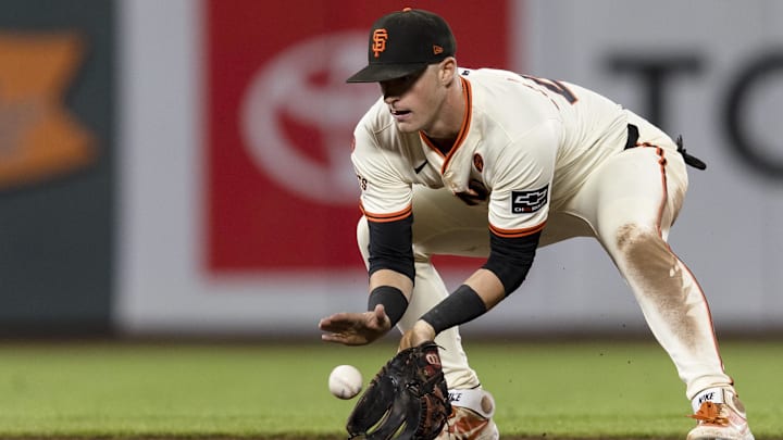 Sep 11, 2024; San Francisco, California, USA; San Francisco Giants shortstop Tyler Fitzgerald (49) fields a ground ball against the Milwaukee Brewers during the eighth inning at Oracle Park