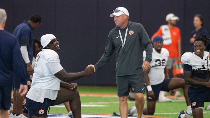 Auburn Tigers head coach Hugh Freeze shakes hands with defensive lineman Malik Blocton (47) during practice at Woltosz Football Performance Center in Auburn, Ala. on Tuesday, Aug. 19, 2025.
