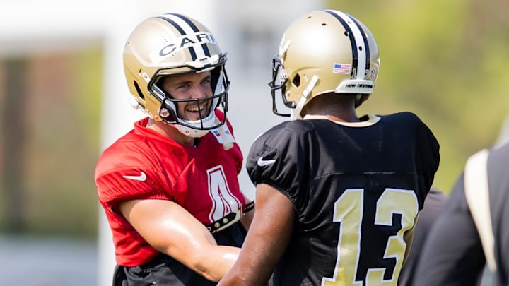 Jul 31, 2023; Metairie, LA, USA; New Orleans Saints wide receiver Michael Thomas (13) and quarterback Derek Carr (4) during training camp at the Ochsner Sports Performance Center. Mandatory Credit: Stephen Lew-Imagn Images