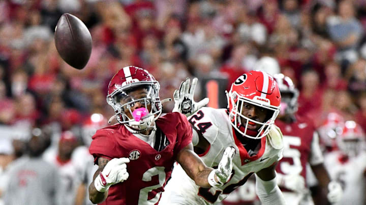 Sep 28, 2024; Tuscaloosa, Alabama, USA; Alabama Crimson Tide wide receiver Ryan Williams (2) makes a circus catch with Georgia Bulldogs defensive back Malaki Starks (24) defending at Bryant-Denny Stadium. Alabama defeated Georgia 41-34
