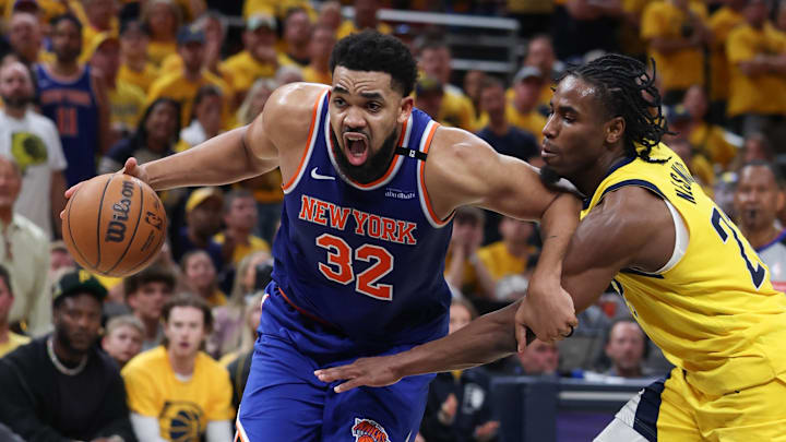 May 31, 2025; Indianapolis, Indiana, USA; New York Knicks center Karl-Anthony Towns (32) drives to the basket against Indiana Pacers guard Andrew Nembhard (2) in the third quarter during game six of the eastern conference finals for the 2025 NBA Playoffs at Gainbridge Fieldhouse.