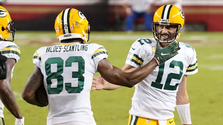 Nov 5, 2020; Santa Clara, California, USA; Green Bay Packers wide receiver Marquez Valdes-Scantling (83) celebrates with quarterback Aaron Rodgers (12) after catching a pass to score a touchdown against the San Francisco 49ers during the second quarter at Levi's Stadium. Mandatory Credit: Kyle Terada-Imagn Images